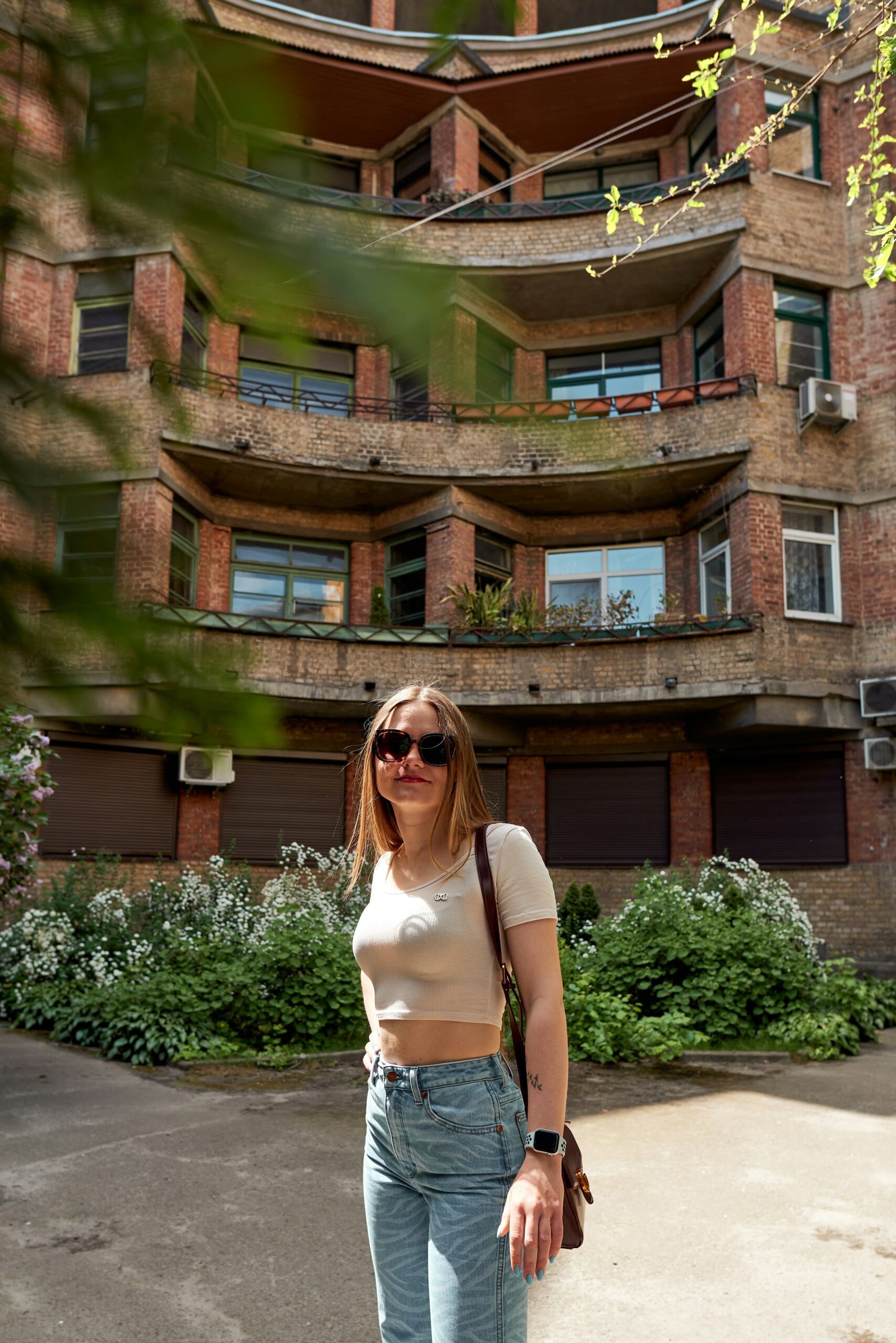 행복주택 a woman standing on a skateboard in front of a building